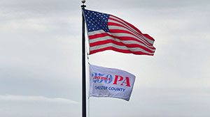 CC250 Flag and U.S. Flag on flag pole