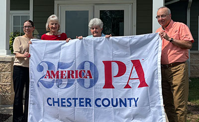 cc250 flag being held by people identified in text below