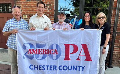 cc250 flag being held by people identified in text below