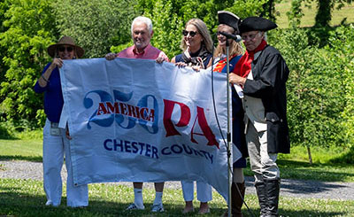 cc250 flag being held by people identified in text below