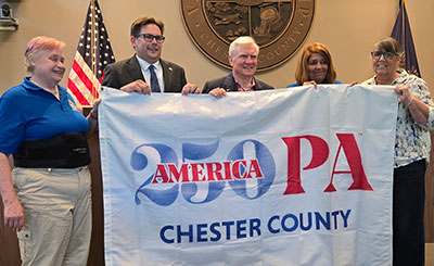 cc250 flag being held by people identified in text below